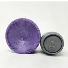 Load image into Gallery viewer, A Legendary Suction Cup on its side next to a soda can for scale reference. All on a white background.