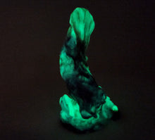 Load image into Gallery viewer, Photo featuring the glow in the dark of the three color marble "Doomstick" tentacle themed adult toy shown from the side.