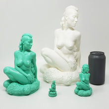 Load image into Gallery viewer, Three size prototype models and mini charm of the figure side of Jasmine's Garden penetratable with a standard soda can for scale on an off white background