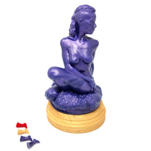 Load image into Gallery viewer, A silicone penetratable sculpture of Jet Setting Jasmine in dark, shimmery purple sitting on her gold stand silicone base, on a white background. There are a line up of plug next to the gold base. The matching dark purple plug is in the sculpture.