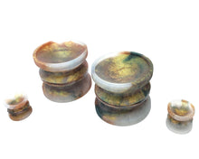 Load image into Gallery viewer, Two King Noire Double-Sided Suction Cups in a three color marble with matching mini charms on a white background