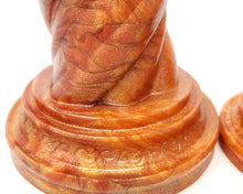 Load image into Gallery viewer, Closeup photo of the base of a Unicorn Horn dildo in special event color Fiery Maple on a white background