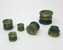 Load image into Gallery viewer, Six Double-Sided Suction Cups from Lust Arts in a deep green and pale gold color in a range of three sizes