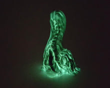 Load image into Gallery viewer, Photo of a Mosswood Dragon fantasy-themed adult toy in original color Forest Spirit (glow in the dark core) in the dark, showing the green glow