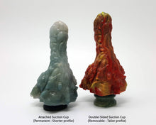 Load image into Gallery viewer, Photo of a Mosswood Dragon fantasy-themed adult toy with an Attached Suction Cup next to a toy with a Double-Sided Suction Cup, showing the height difference