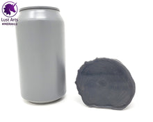Load image into Gallery viewer, Preview photo of the underside of a pre-made toy next to a standard size soda can for scale