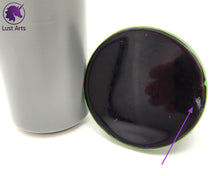 Load image into Gallery viewer, Preview photo showing the base underside (with an arrow pointing to the inclusion flaw) of a pre-made Tentacle adult toy next to a standard size soda can for scale
