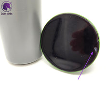 Load image into Gallery viewer, Preview photo showing the base underside (with an arrow pointing to the inclusion flaw) of a pre-made Tentacle adult toy next to a standard size soda can for scale