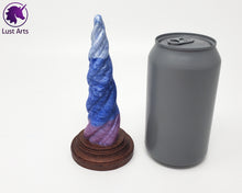 Load image into Gallery viewer, Photo of a Unicorn Horn insertable toy next to a soda can for scale on an off-white background