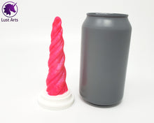 Load image into Gallery viewer, Photo of a Unicorn Horn insertable toy next to a soda can for scale on an off-white background
