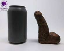 Load image into Gallery viewer, A Frank's Monster insertable sits next to a soda can on a white background.