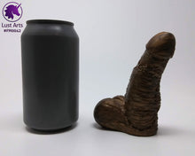 Load image into Gallery viewer, A Frank's Monster insertable sits next to a soda can on a white background.