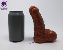 Load image into Gallery viewer, A Frank's Monster insertable sits next to a soda can on a white background.