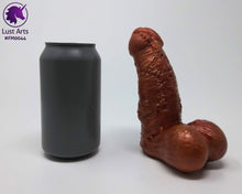 Load image into Gallery viewer, A Frank's Monster insertable sits next to a soda can on a white background.