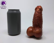 Load image into Gallery viewer, A Frank's Monster insertable sits next to a soda can on a white background.