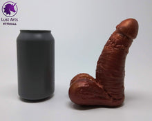 Load image into Gallery viewer, A Frank's Monster insertable sits next to a soda can on a white background.