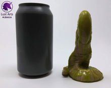 Load image into Gallery viewer, Photo of a Lust Burster insertable toy next to a soda can for scale on an off-white background