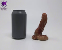 Load image into Gallery viewer, Photo of a Lust Burster insertable toy next to a soda can for scale on an off-white background