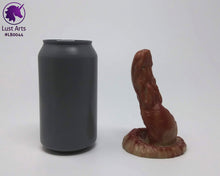 Load image into Gallery viewer, Photo of a Lust Burster insertable toy next to a soda can for scale on an off-white background