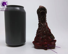 Load image into Gallery viewer, Preview photo (with arrows pointing to bubble flaws) rotating around a pre-made Mosswood Dragon adult toy next to a standard size soda can for scale