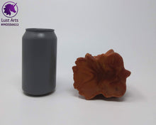 Load image into Gallery viewer, Preview photo of the underside of a pre-made toy next to a standard size soda can for scale