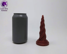 Load image into Gallery viewer, Photo of a Unicorn Horn insertable toy next to a soda can for scale on an off-white background