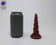 Load image into Gallery viewer, Photo of a Unicorn Horn insertable toy next to a soda can for scale on an off-white background