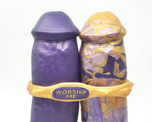 Load image into Gallery viewer, Close up photo of the top of a dual-density and solid King Noire insertable adult toys in color Queen's Command, bound together by a "Worship Me" inlaid text Edging Body Band