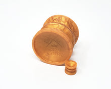 Load image into Gallery viewer, King Noire Double-Sided Suction Cup in Jasmine's Gold on its side with a mini charm version on a white background