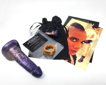 Load image into Gallery viewer, FEMDOM insertable toy with Jet Setting Jasmine's introduction, a prototype Edging Body Band color, resealable plastic bag, and black satin drawstring bag