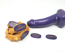 Load image into Gallery viewer, Close up photo of three stacked Edging Body Bands with inlaid text on a marbled toy next to two unattached command plaques and a dual density insertable, on a white background