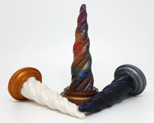Load image into Gallery viewer, Three different Original Colors of Unicorn Horn insertable toys on a white background. The center toy is standing up and the other town are on their sides pointing to center.