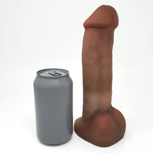 Load image into Gallery viewer, Realistic airbrushed dildo of King Noire&#39;s likeness next to a standard soda can for size comparison, on a white background
