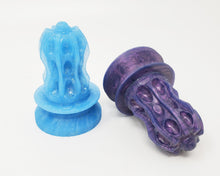 Load image into Gallery viewer, A glittery blue and a deep purple Thruster Suction Cup Handle on a white background
