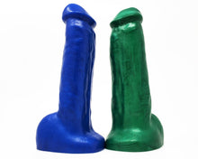 Load image into Gallery viewer, Two solid color King Noire toys in Electric Blue and Money Green
