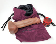 Load image into Gallery viewer, Realistic airbrushed dildo of King Noire&#39;s likeness with a Double-Sided Suction Cup and Royal Fetish Toy Bag on a white background

