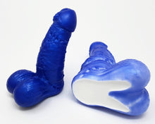 Load image into Gallery viewer, Two Frank&#39;s Monster Frankenstein-themed fantasy dildos from Lust Arts in Blue and Blue/Gloss White, the dual-color/density toy is on its side showing the bottom

