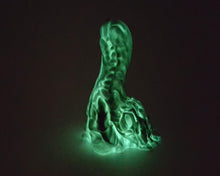 Load image into Gallery viewer, Photo of a Mosswood Dragon fantasy-themed adult toy in original color Forest Spirit (glow in the dark core) in the dark, showing the green glow
