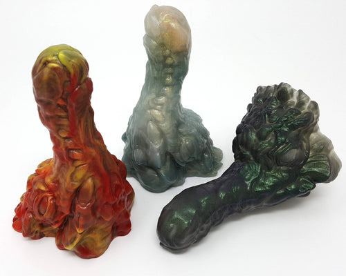 Group image of all three original colors for the Mosswood Dragon fantasy-themed adult toy on a white background