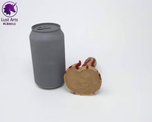 Load image into Gallery viewer, Photo of the underside of a small Lust Burster insertable toy next to a soda can for scale on a white background
