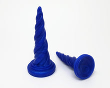 Load image into Gallery viewer, Two solid color &quot;Blue&quot; Unicorn Horn fantasy adult toy dildos from Lust Arts, one on its base and the other on its side showing the suction cup base underside
