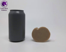 Load image into Gallery viewer, Photo of the underside of a Lust Burster insertable toy next to a soda can for scale on an off-white background
