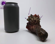 Load image into Gallery viewer, Preview photo (with arrows pointing to bubble flaws) rotating around a pre-made Mosswood Dragon adult toy next to a standard size soda can for scale
