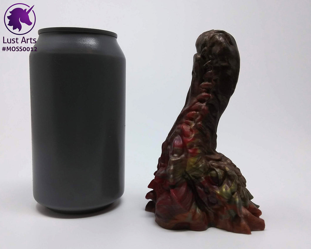Preview photo rotating around a pre-made Mosswood Dragon adult toy next to a standard size soda can for scale