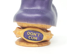 Load image into Gallery viewer, Closeup of the base of a King Noire insertable adult toy with a Double-Sided Suction Cup wrapped with an Edging Body Band with command message &quot;DON&#39;T CUM&quot;
