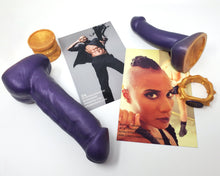 Load image into Gallery viewer, King Noire and FEMDOM collection insertable toys on their sides with an Edging Body Band, Double-Sided Suction Cup, and two visual printed inserts on a white background
