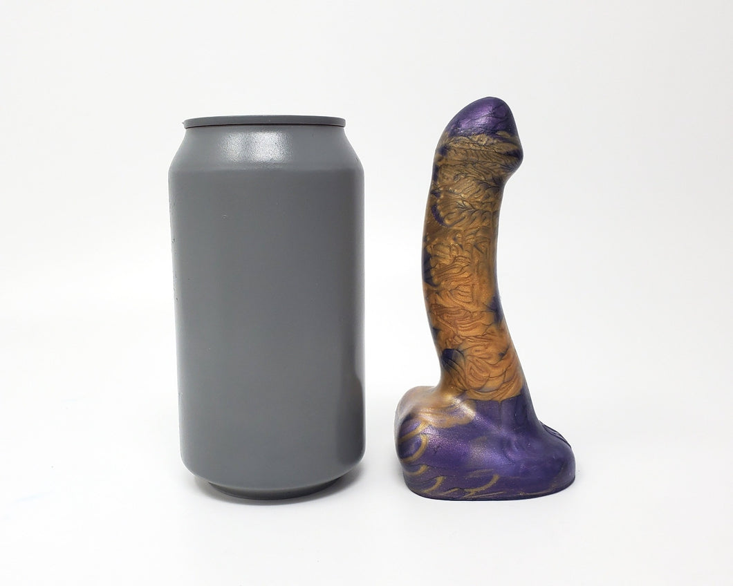 Side view of a Lady Royal Fetish FEMDOM insertable adult toy on a white background with a soda can for scale