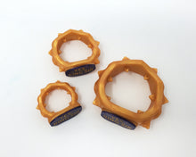 Load image into Gallery viewer, Top view photo of three Edging Body Bands, one of each size, with inlaid text &quot;YES, KING SIR&quot; on an off-white background.
