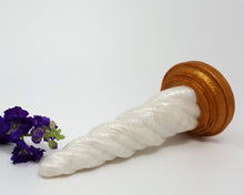 Load image into Gallery viewer, A Sunlight color Unicorn Horn insertable toy on its side with purple flowers on a white background

